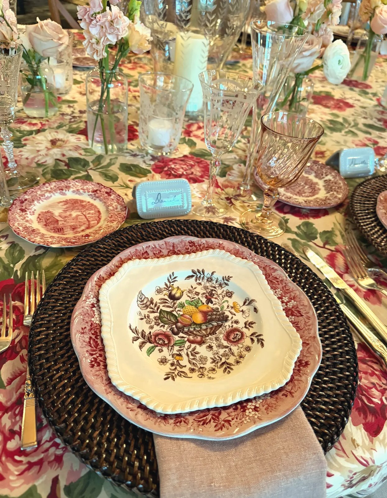 A pink and brown transferware place setting at a recent event