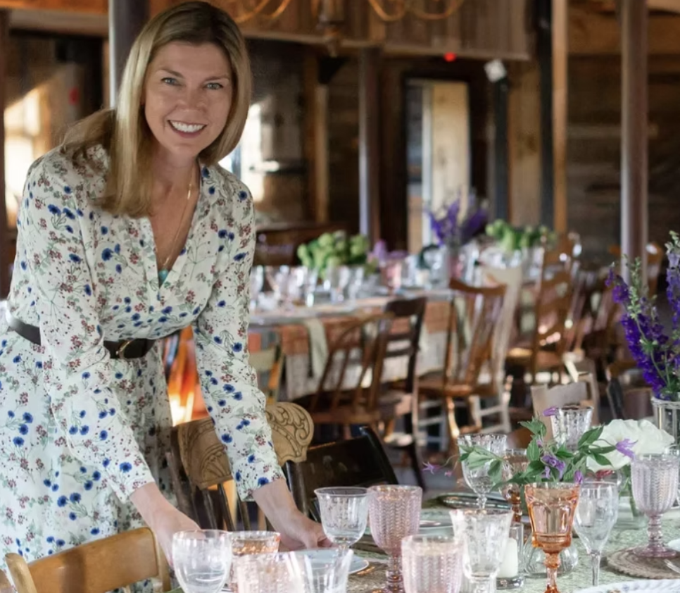 Donielle Hawley styling a table with vintage glassware from the collection